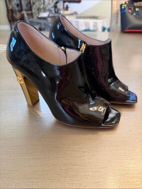 CHANEL Black Patent Peep-Toe Booties with Gold Heel Accent